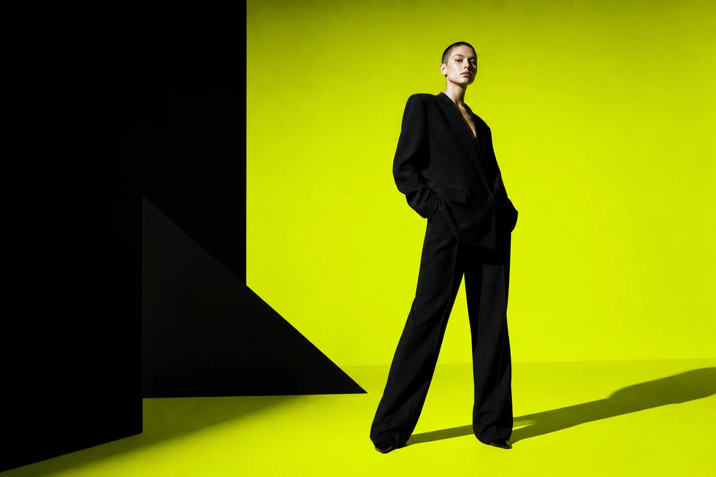 Fashion campaign portrait on an acid-lime architectural set